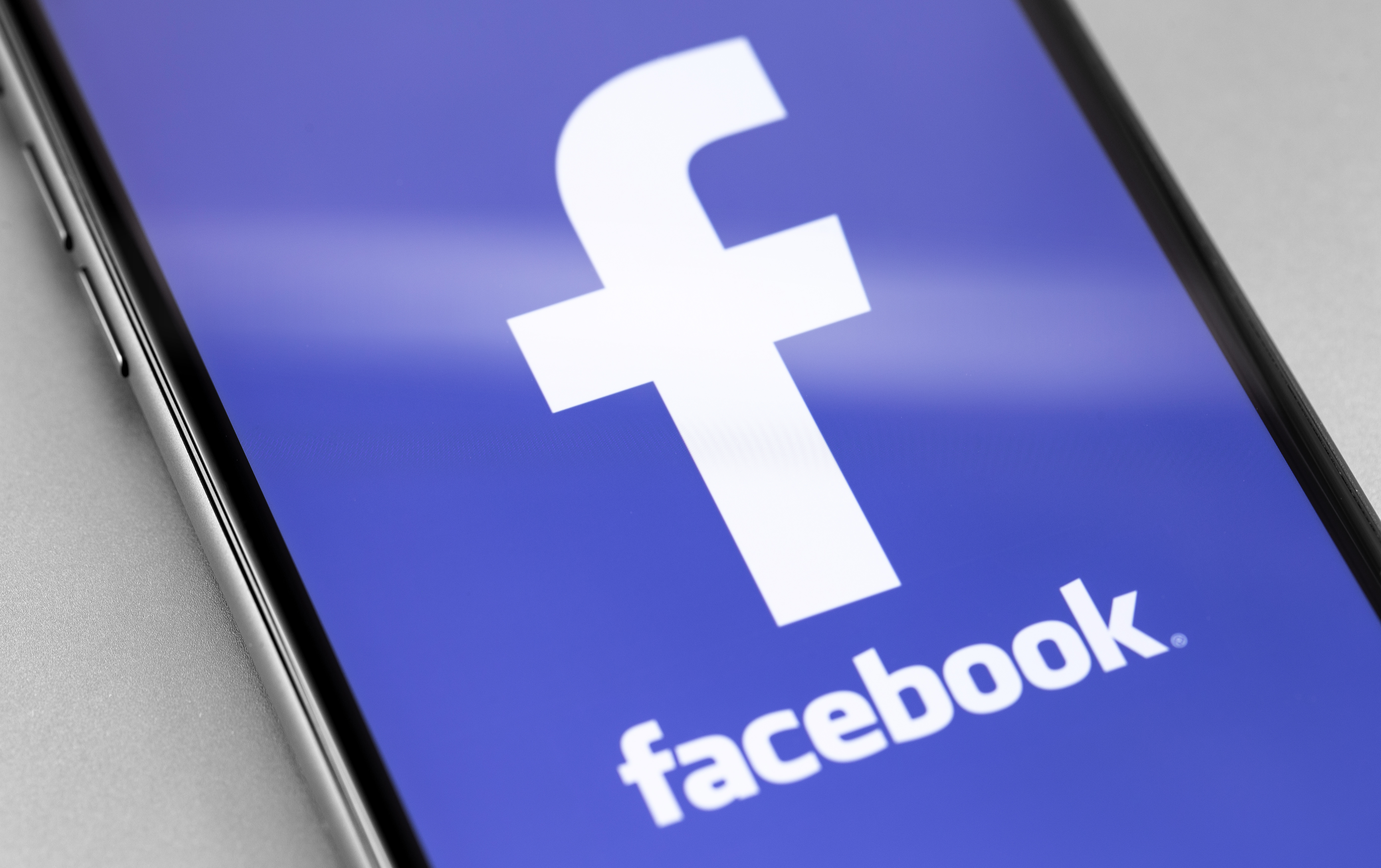 The Facebook app opens on a smartphone